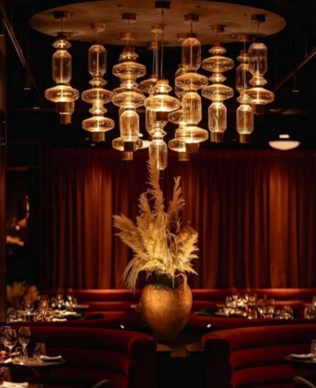 Cluster chandelier of ribbed glass cylinders